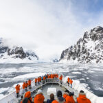 A cruise ship approaches the Lemaire Channel, Antarctica